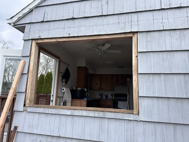 Kitchen window opening framed and prepped during a window replacement